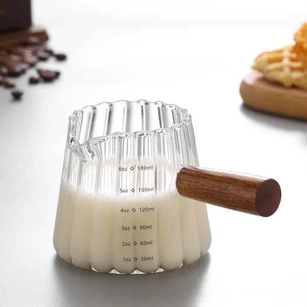 Detail of the wooden handle on the glass espresso cup