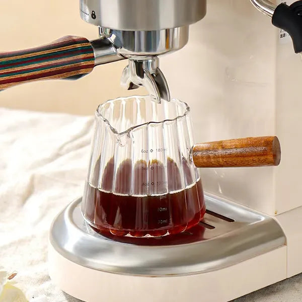 Casora mini glass coffee cup with wooden handle filled with coffee