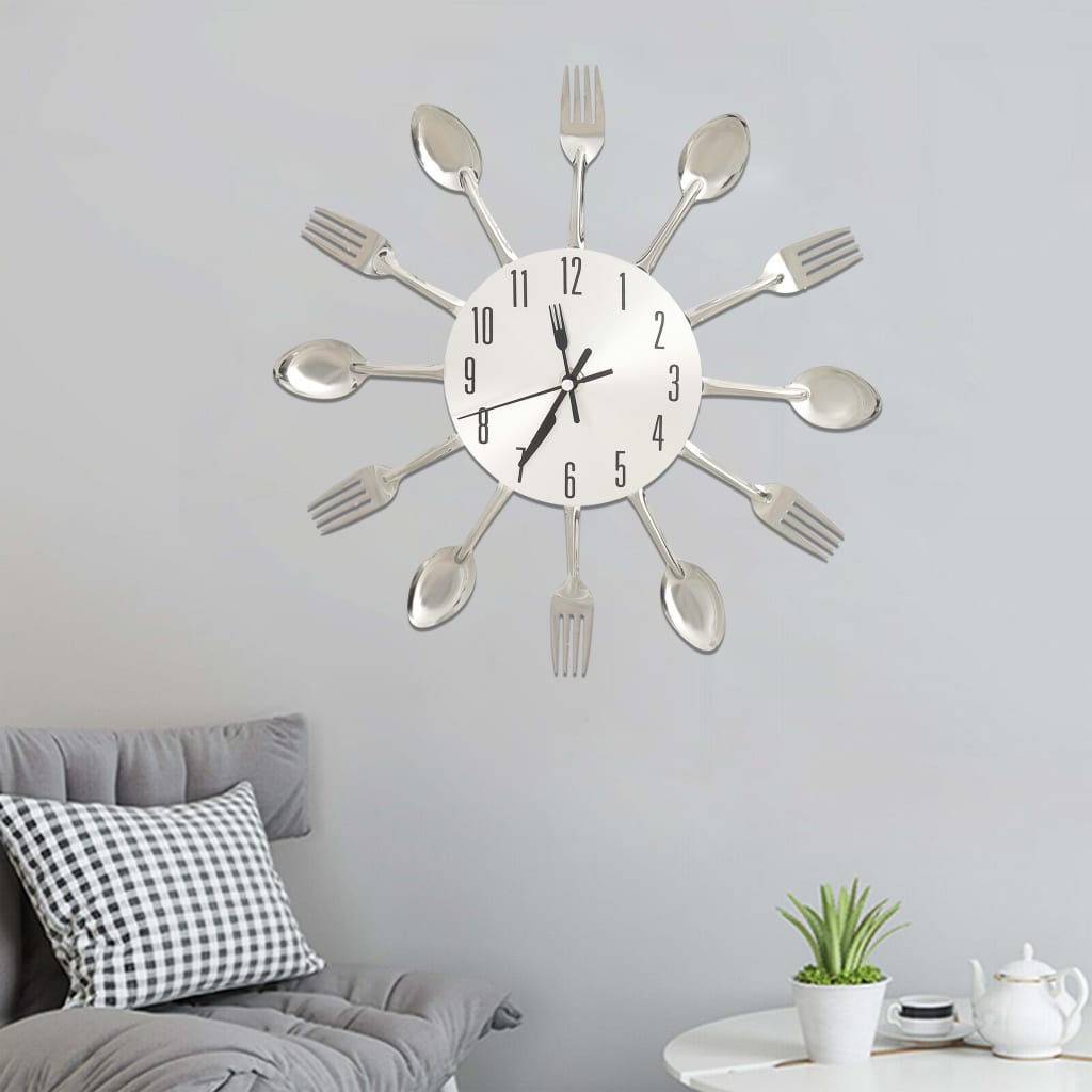 Cutlery wall clock displayed on a kitchen wall